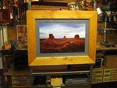 Rustic handcrafted frame for 
Curtis Brown’s stormy view of Monument Valley